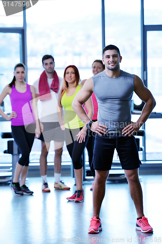 Image of Group of people exercising at the gym