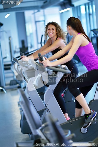 Image of Group of people running on treadmills