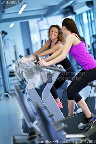 Image of Group of people running on treadmills