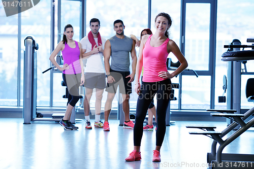 Image of Group of people exercising at the gym