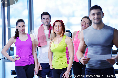 Image of Group of people exercising at the gym