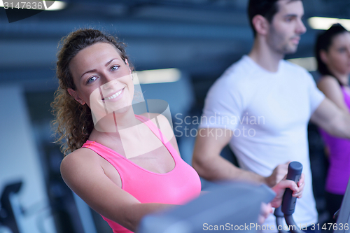 Image of Group of people running on treadmills