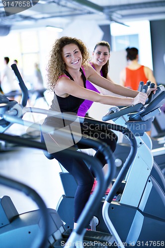 Image of Group of people running on treadmills