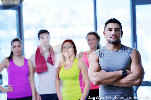 Image of Group of people exercising at the gym