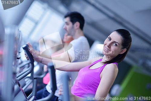 Image of Group of people running on treadmills