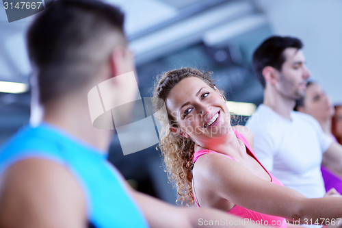 Image of Group of people running on treadmills