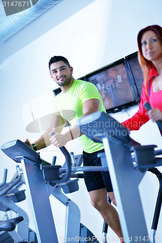 Image of Group of people running on treadmills