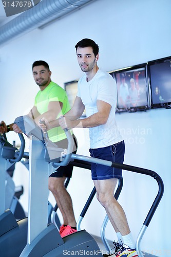 Image of Group of people running on treadmills
