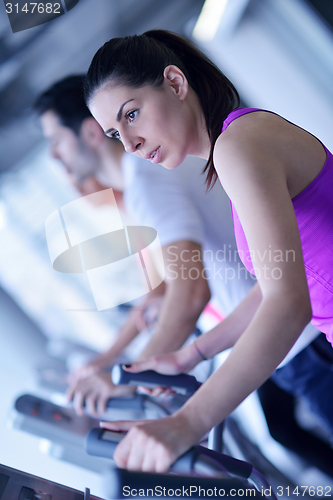 Image of woman exercising on treadmill in gym