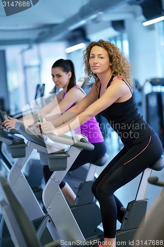 Image of Group of people running on treadmills