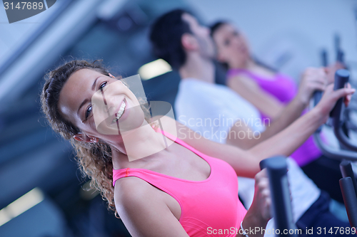 Image of Group of people running on treadmills