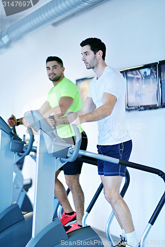 Image of Group of people running on treadmills