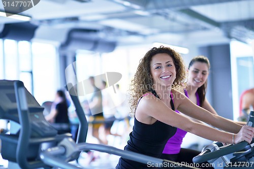 Image of Group of people running on treadmills