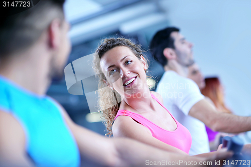 Image of Group of people running on treadmills