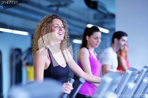 Image of Group of people running on treadmills