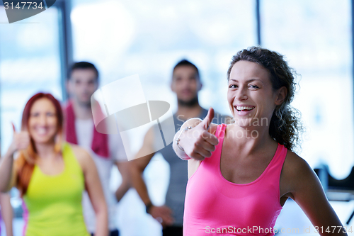 Image of Group of people exercising at the gym