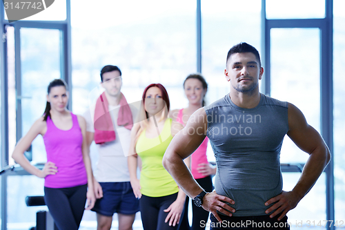 Image of Group of people exercising at the gym