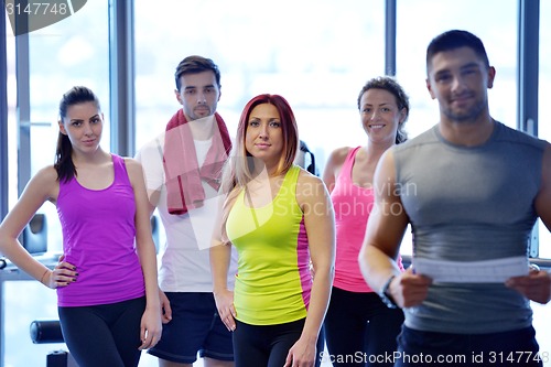 Image of Group of people exercising at the gym