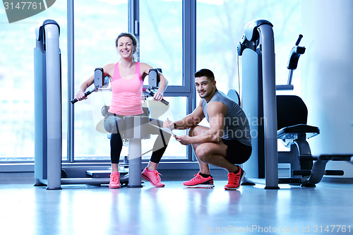 Image of woman exercising with her personal trainer