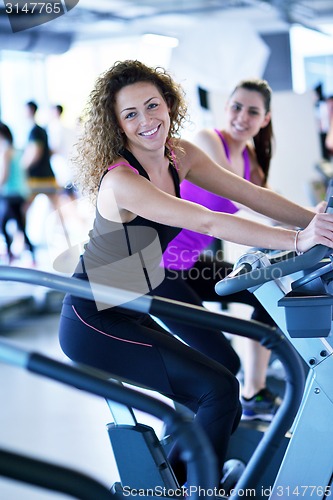 Image of Group of people running on treadmills