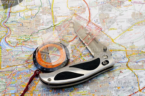 Image of Compass and knife on a map