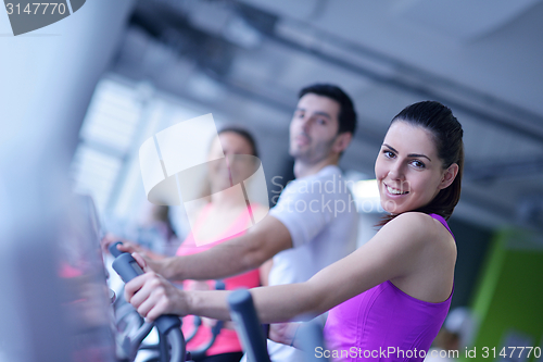 Image of Group of people running on treadmills
