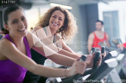 Image of Group of people running on treadmills