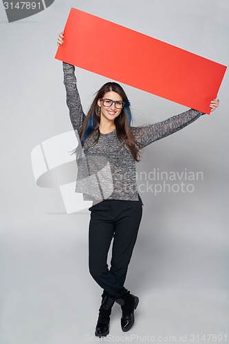 Image of Woman holding red blank cardboard