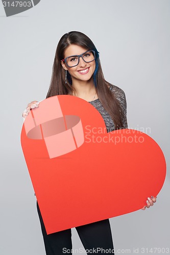 Image of Woman holding big heart shape