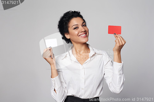 Image of Business woman showing blank credit card