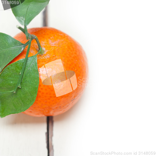 Image of tangerine mandarin orange on white table