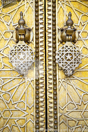 Image of metal rusty  brown    morocco in gold   facade home and safe pad