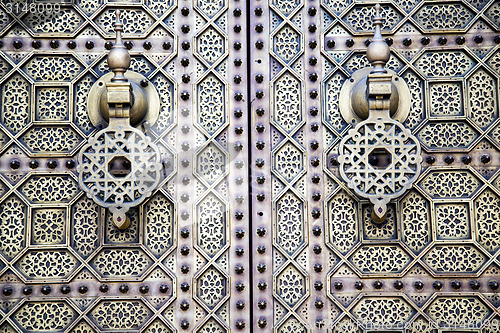 Image of brown  morocco in africa  facade home and rusty safe padlock 