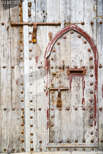 Image of antique door in morocco africa rusty brown