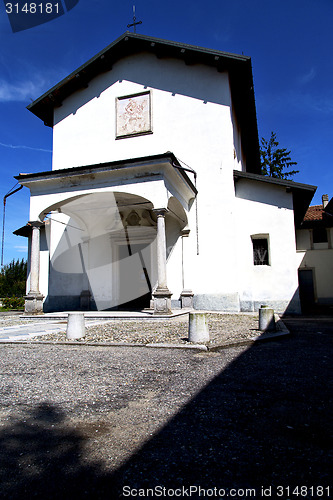 Image of  church  in  the villadosia  old   closed brick tower sidewal  l