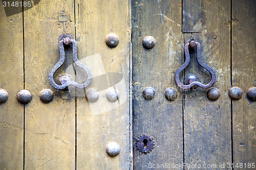 Image of brown  morocco in africa the old  home and rusty safe padlock 