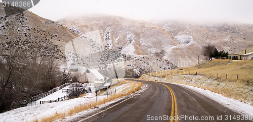 Image of Fresh Snow Blankets Hillside Rural Country Scene Two Lane Road
