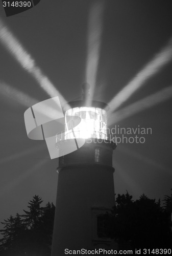Image of Lighthouse Beams From Lens Rainy Night Pillars of Light