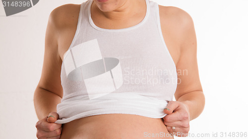 Image of Pregnant Woman Braless Breasts Wearing White Wife Beater Tank To