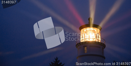 Image of Lighthouse Beams Illumination Into Rain Storm Maritime Nautical 