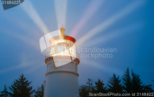 Image of Lighthouse Beams Illumination Into Rain Storm Maritime Nautical 