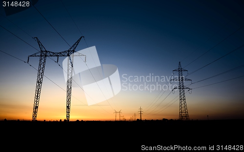 Image of Large transmission towers at blue hour 