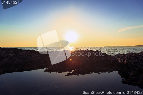 Image of Beach with rocks and a cloudy sky