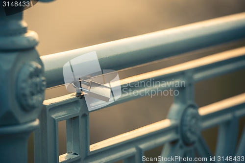 Image of Padlock on fence, symbol of love