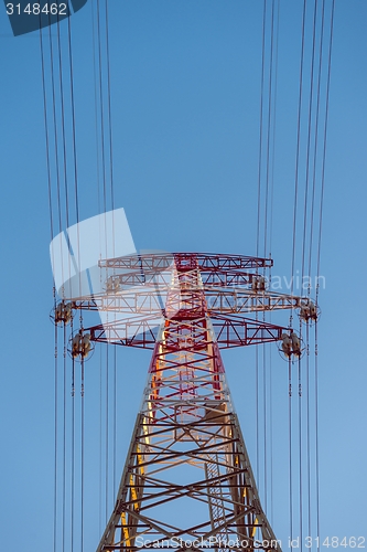 Image of Large transmission towers at sunset