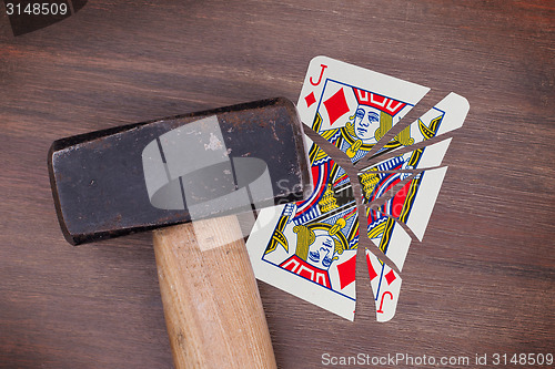 Image of Hammer with a broken card, jack of diamonds