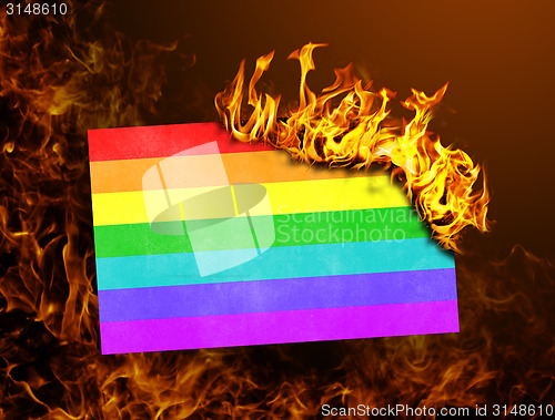 Image of Flag burning - Rainbow flag