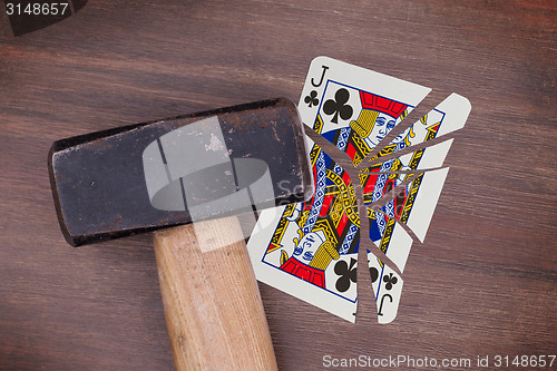 Image of Hammer with a broken card, jack of clubs