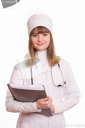 Image of Medical Officer in the form of working with documents in hand
