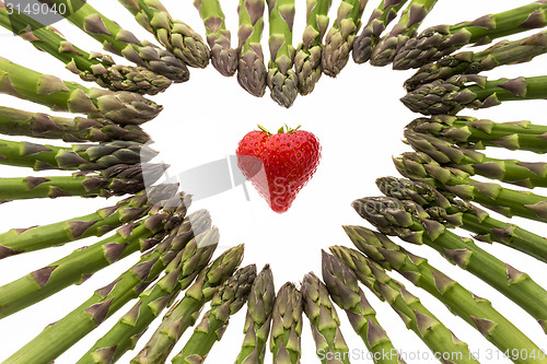 Image of Strawberry Amidst A Heart Made Of Asparagus Spears